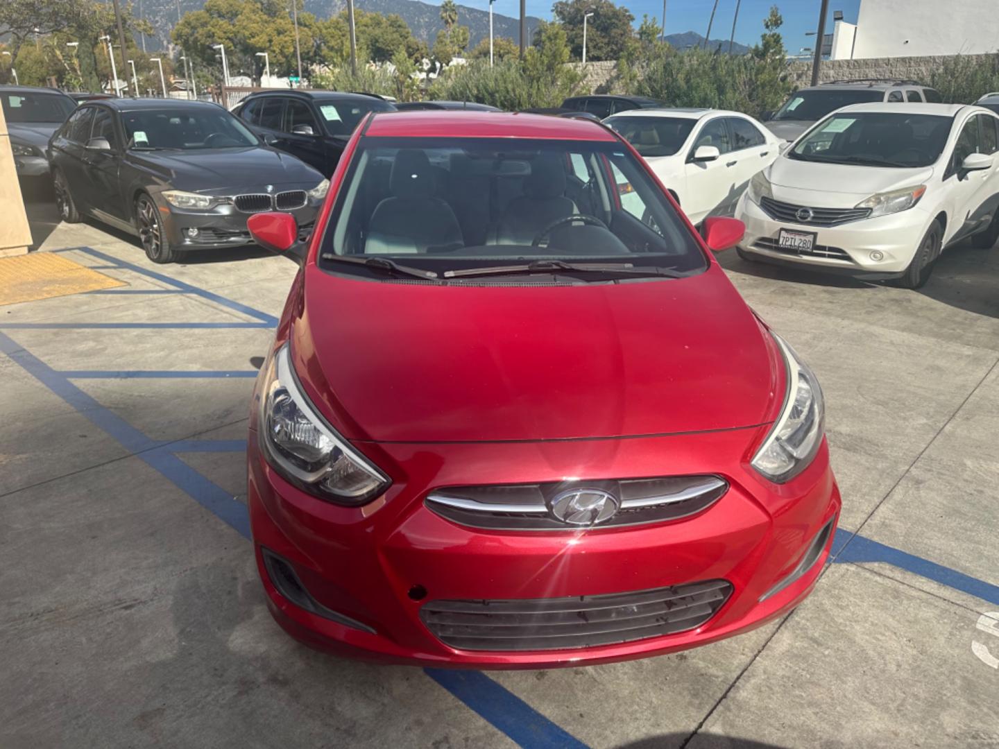 2015 Red /Gray Hyundai Accent GLS Sedan 4D (KMHCT4AE2FU) with an 4-Cyl, 1.6L engine, Auto, 6-Spd w/Overdrive transmission, located at 30 S. Berkeley Avenue, Pasadena, CA, 91107, (626) 248-7567, 34.145447, -118.109398 - The 2015 Hyundai Accent 4-Door Sedan stands as a testament to Hyundai's commitment to quality, efficiency, and value. Located in Pasadena, CA, our dealership specializes in providing a wide range of used BHPH (Buy Here Pay Here) cars, trucks, SUVs, and vans, including the remarkable Hyundai Accent. - Photo#7